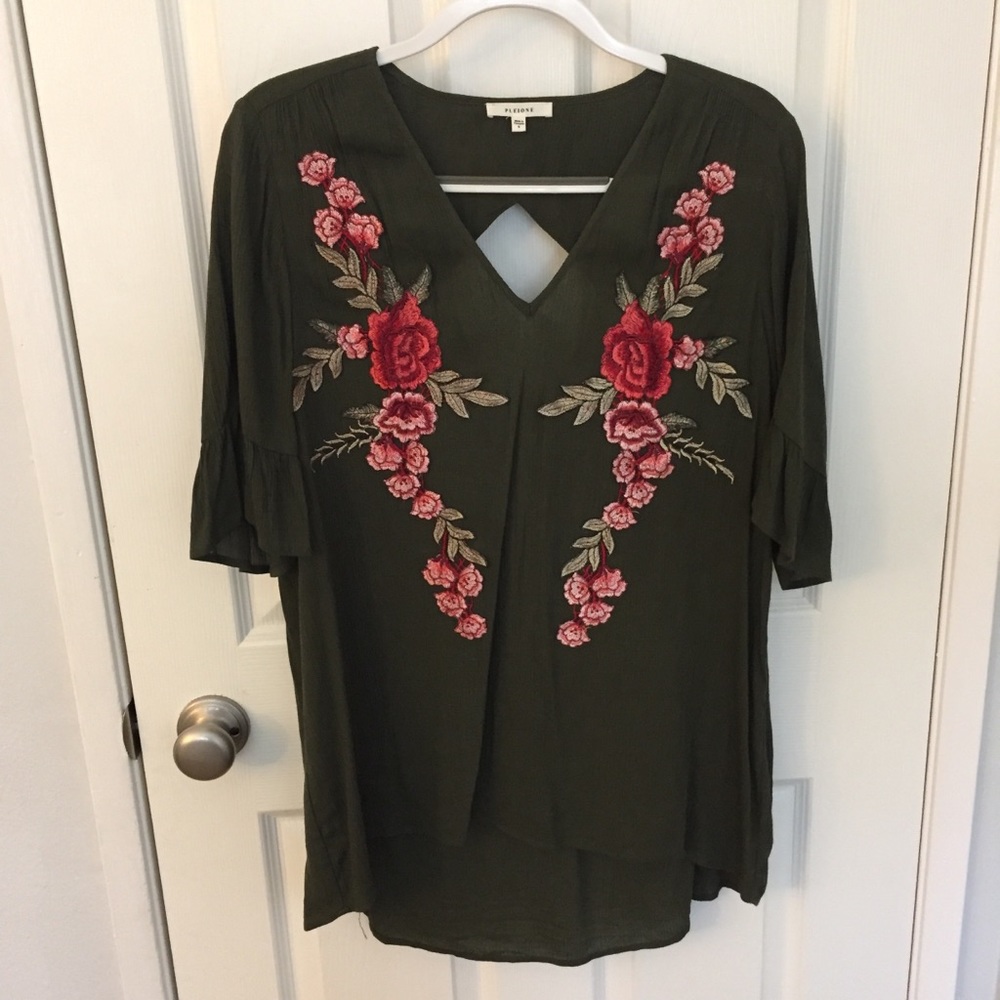 green tunic with embroidered flowers